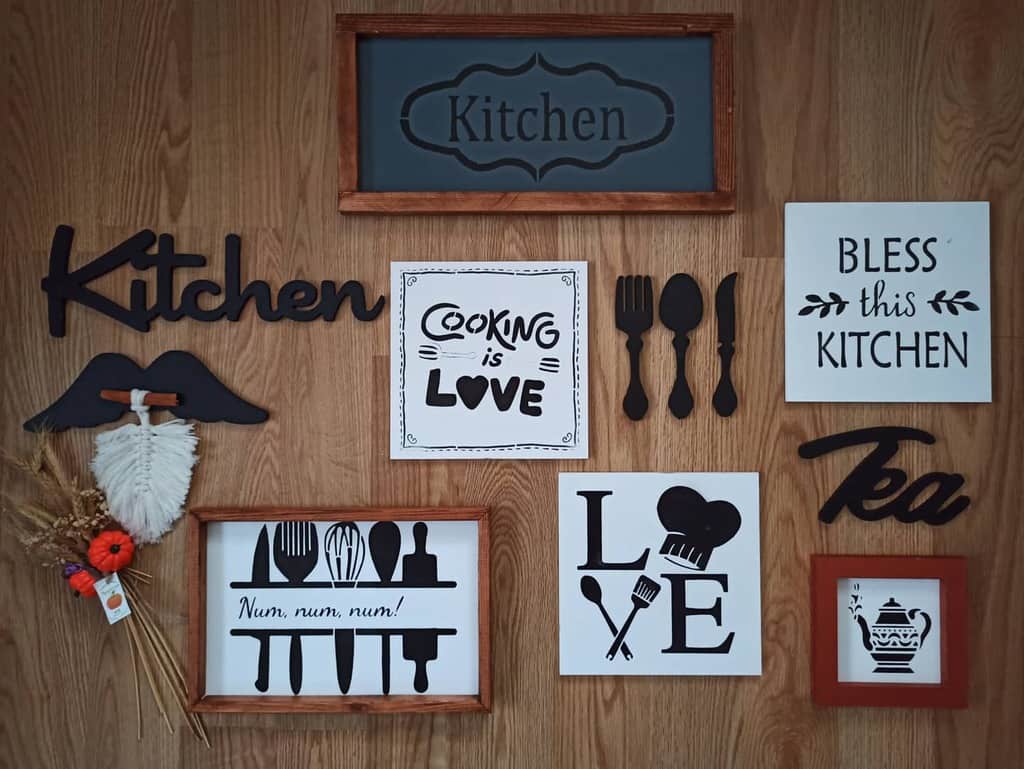 wall with kitchen themed slogan artwork 