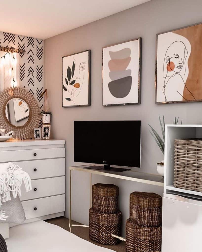 small bedroom with weave basket storage and framed wall prints