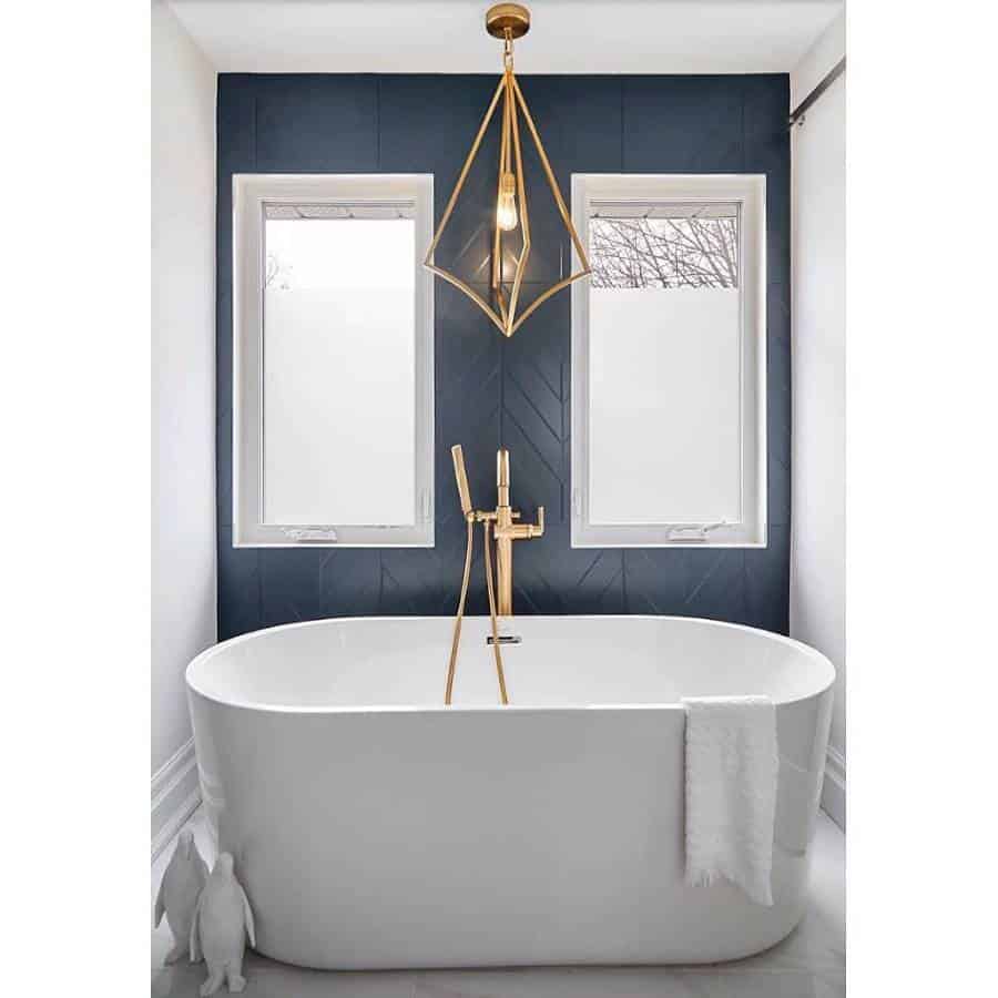 blue shiplap paneling white bathtub