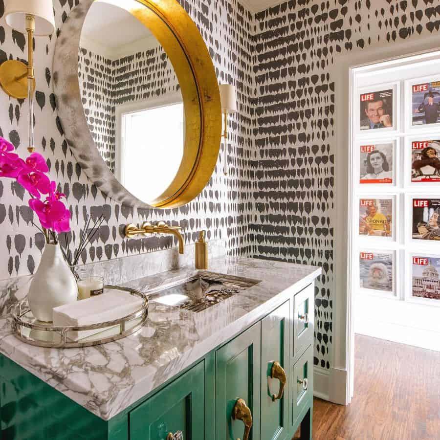 abstract wallpaper in vintage powder room with green cabinet vanity 