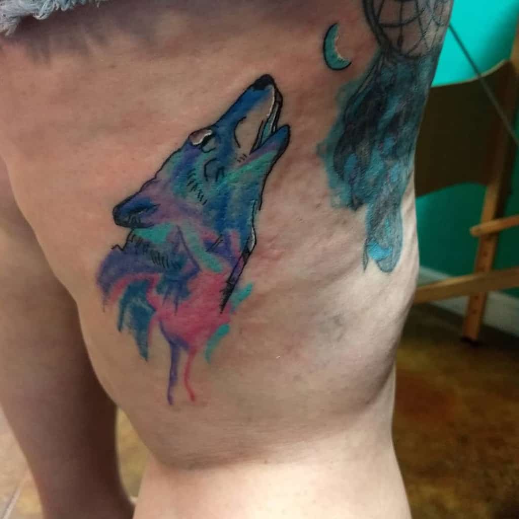 watercolor colorful howling wolf tattoo jokertatts