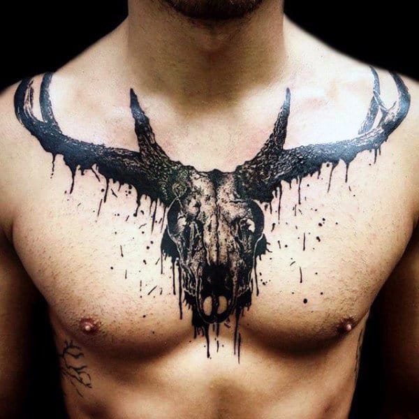 Watercolor Dripping Deer Skull Antler Tattoo On Chest Of Man