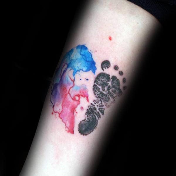 Watercolor With Black Ink Footprint Forearm Tattoo On Guy