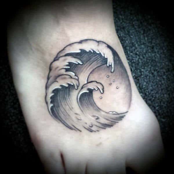 Waves Inside Circular Stamp Tattoo On Foot For Male