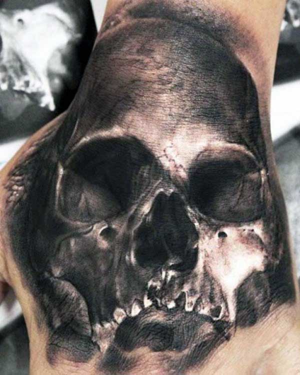 White And Black Ink Skull Shaded Tattoos On Hand For Gentlemen