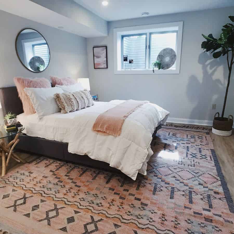 white basement bedroom with rug