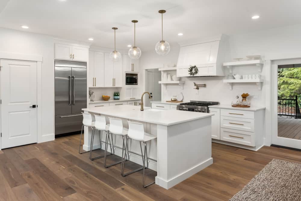large modern white farmhouse kitchen hardwood floors pendant lights