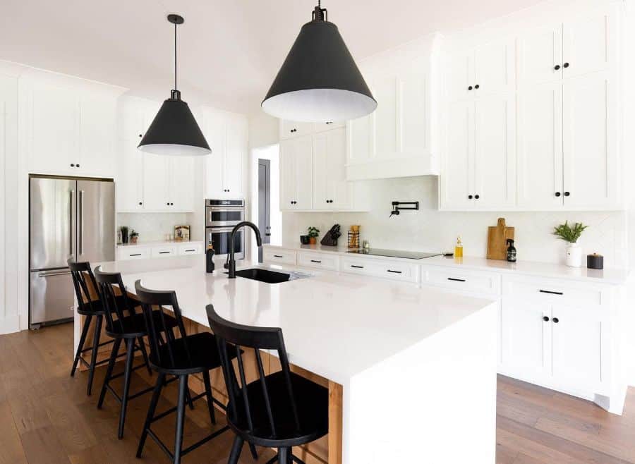 modern white kitchen with black accents four chairs 