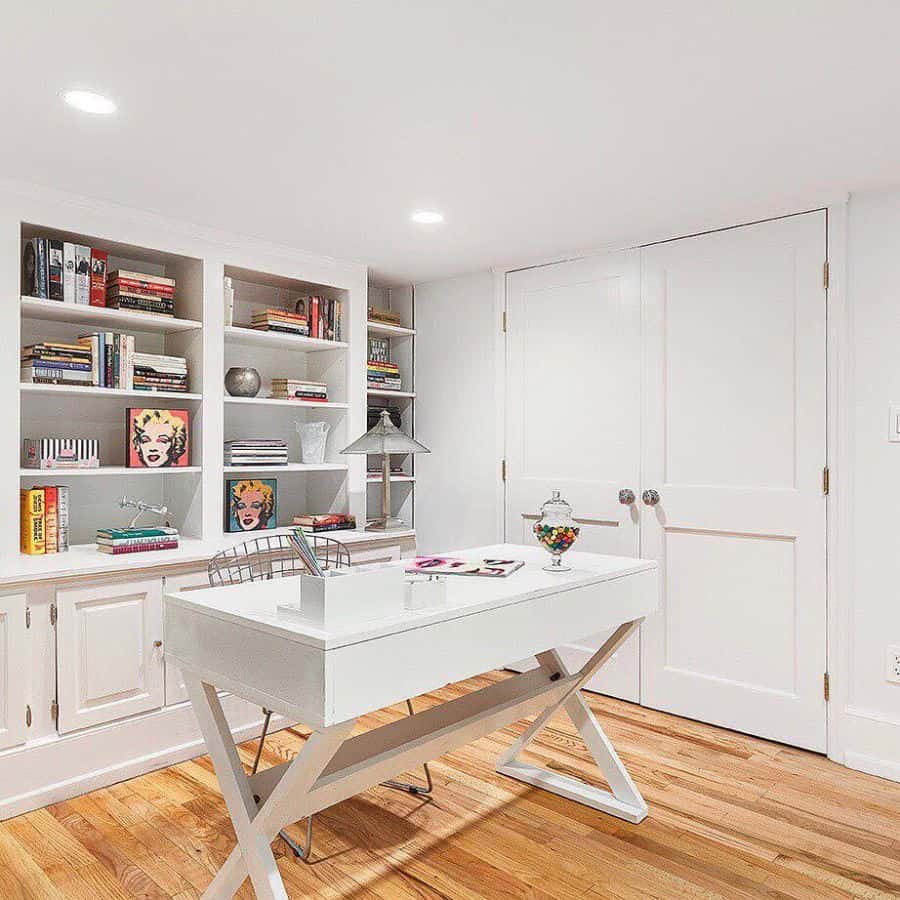 home office white desk built-in shelves and cabinets 