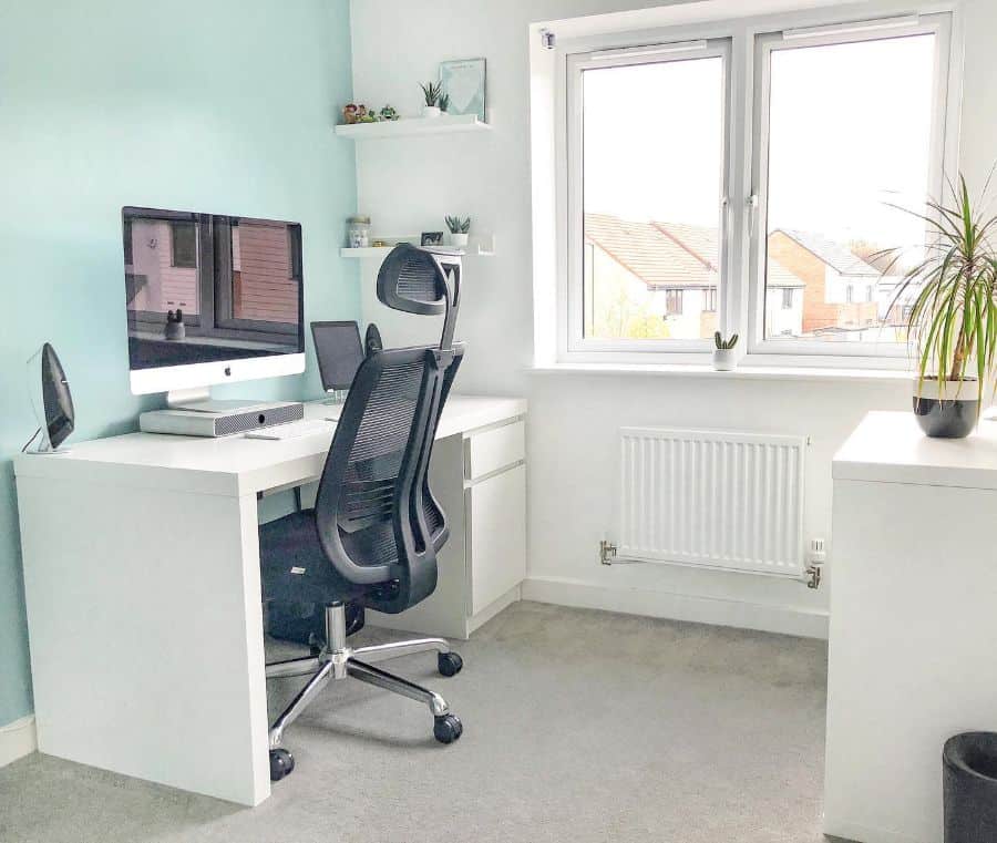 small home office blue accent wall white desk black office chair 