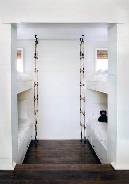 white bunk beds with rope ladders