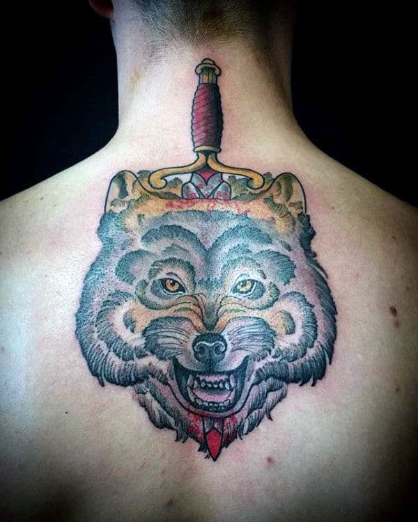 Wolf With Dagger Male Upper Back Tattoo Designs