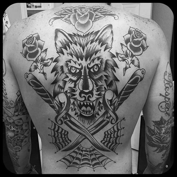 Wolf With Traditional Dagger And Spider Web Mens Back Tattoos
