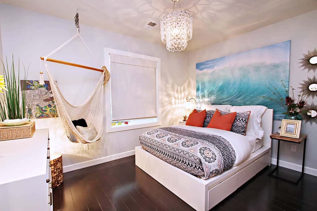 ocean themed bedroom with bed and hammock