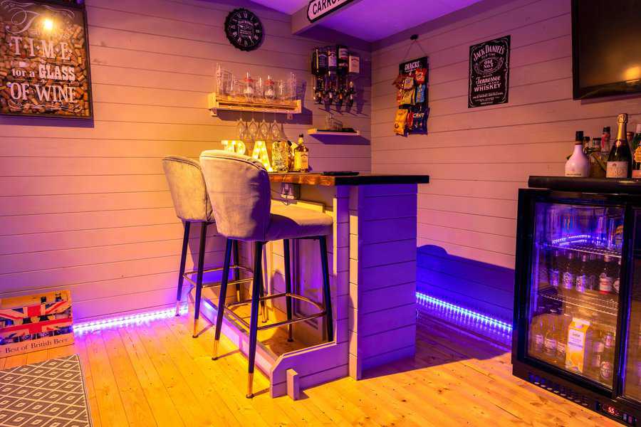 wood home bar purple led lights