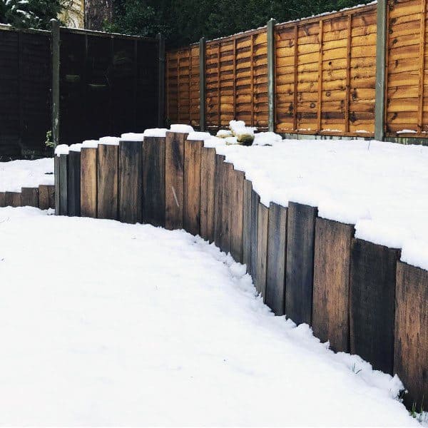 wood retaining wall snow