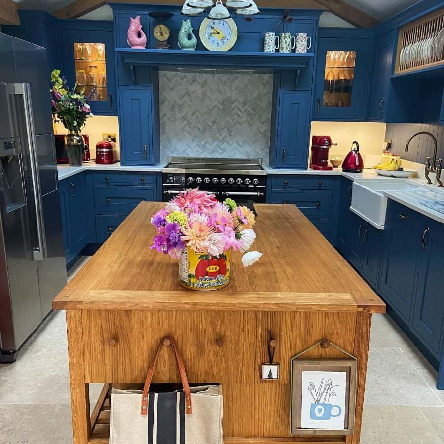 blue cabinet kitchen with wood island 