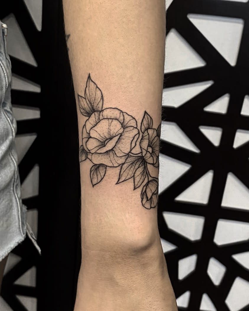 wrap around flower wrist tattoo emi1yelizabeth