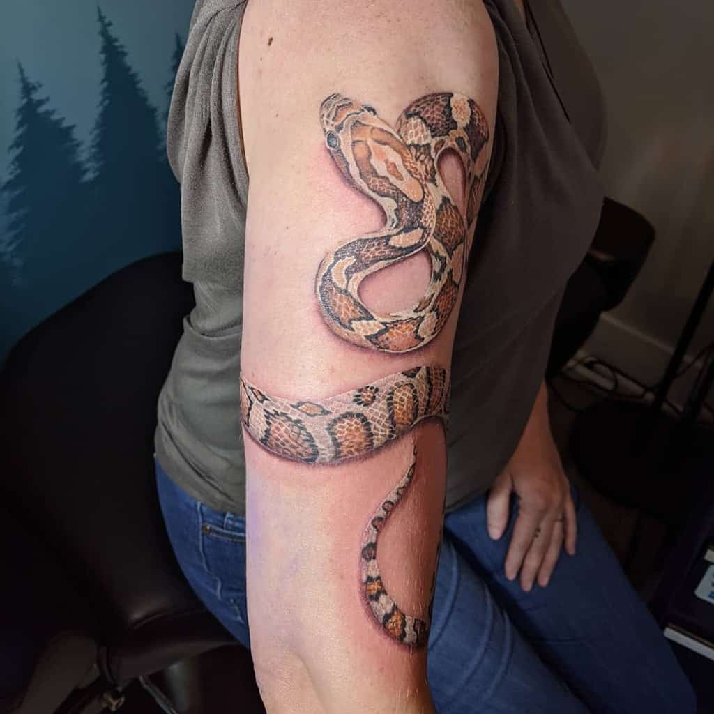 wrap around snake arm tattoo annie.tattoos