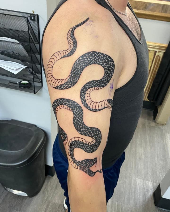 wrap around snake arm tattoo uniontattooandpiercing