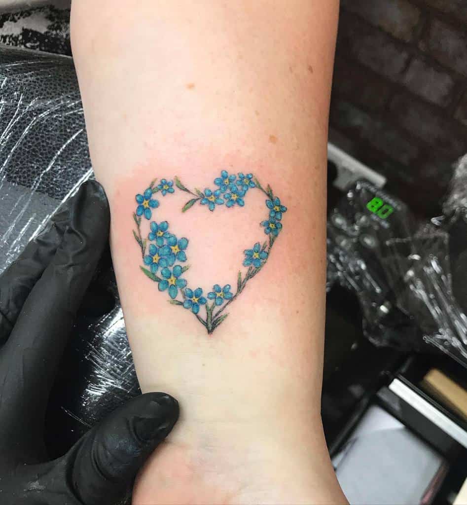 Iris flower in a heart tattoo