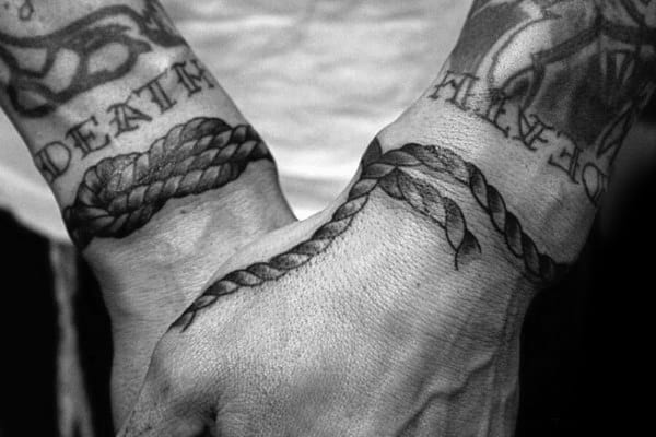 Wrist Tattoos Of Knots On Man