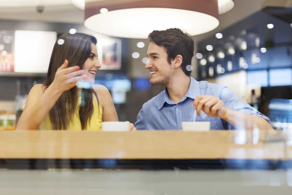 young couple during discussion in cafe